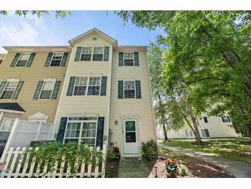 Traditional two-story townhouse featuring green shutters, a white front door, and well-maintained landscaping at 2920 Barrymore St # 106, Raleigh, NC 27603