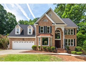 Charming two-story brick home with a two car garage and manicured front yard at 3 White Ash Dr, Durham, NC 27712