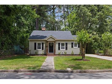 Charming house with manicured lawn, grey siding and black shutters at 308 Greenwood Dr, Durham, NC 27704