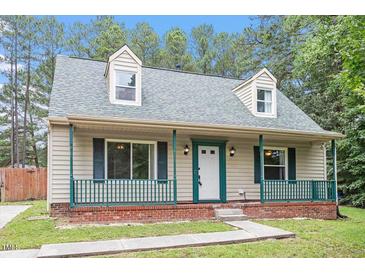 Charming home featuring a cozy front porch and dormer windows at 4709 Tyne Dr, Durham, NC 27703