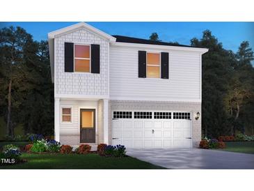 New construction home with black shutters, brick accents, and a two-car garage at 648 Red River Dr, Garner, NC 27529