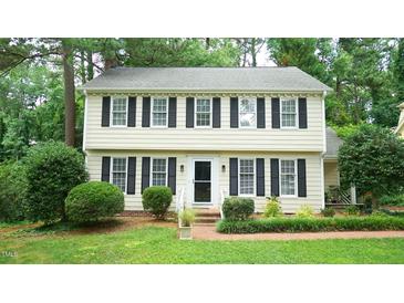 Charming two-story home with black shutters and beautifully landscaped front yard at 304 Ramblewood Dr, Raleigh, NC 27609