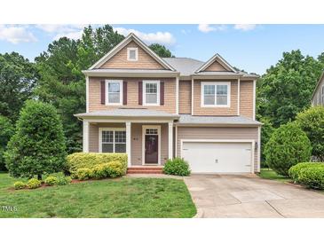 Charming two-story home with a manicured lawn, attached garage and beautiful landscaping at 108 Teagan Ct, Chapel Hill, NC 27516
