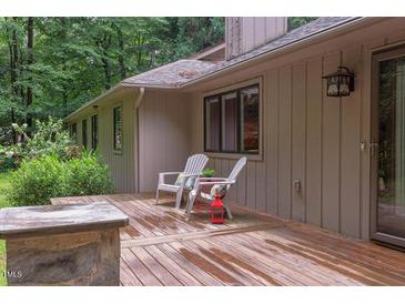 Inviting deck with chairs for relaxing outdoors at 3833 Hidden Branches Dr, Raleigh, NC 27613