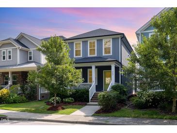 Charming two-story home with a landscaped front yard, classic architecture, and inviting curb appeal at 442 Granite Mill Blvd, Chapel Hill, NC 27516