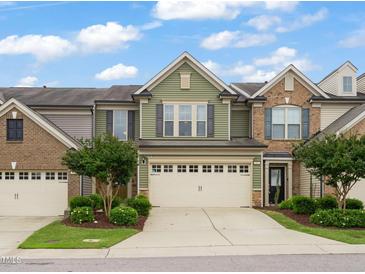 Charming townhome with a two-car garage, beautiful landscaping, and inviting curb appeal at 507 Brier Crossings Loop, Durham, NC 27703