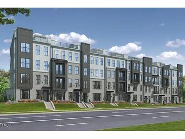 Stunning new construction townhomes featuring a modern architectural design and meticulously landscaped grounds at 509 Kildaire Farm Rd # 106, Cary, NC 27511