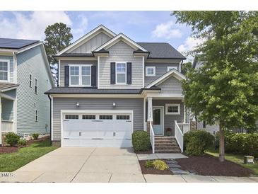 Charming two-story home with a manicured lawn and an attached two-car garage in a well-kept neighborhood at 554 Beacon Ridge Blvd, Chapel Hill, NC 27516