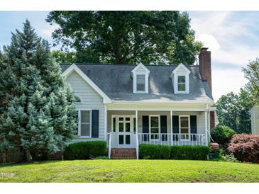 Charming single-Gathering home featuring a cozy front porch and well-maintained landscaping at 101 Stefi Ct, Garner, NC 27529