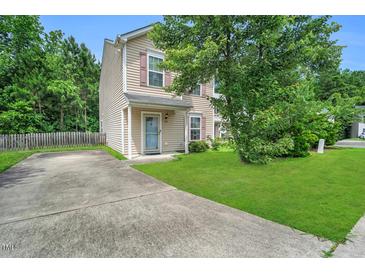 Charming two-story home with a well-maintained lawn and long private driveway at 110 Knightwood Dr, Durham, NC 27703