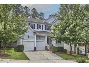 Charming two-story home with a two-car garage, black shutters, and a well-manicured front yard at 1601 Bellenden Dr, Durham, NC 27713