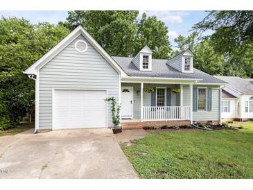 Charming single-story home with manicured lawn and blue shutters at 522 Johnson St, Garner, NC 27529