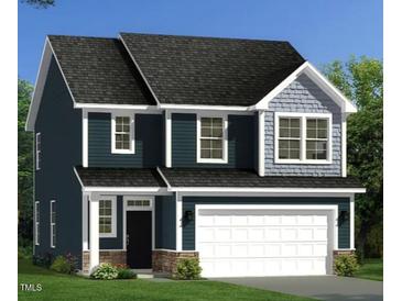New two-story home featuring dark siding, gray shingles, a front-entry two-car garage and professional landscaping at 233 Steel Spring Rd # 24, Angier, NC 27501