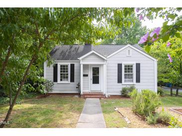 Charming one story home with black shutters and a sidewalk leading up to the front door at 2423 Farthing St, Durham, NC 27704