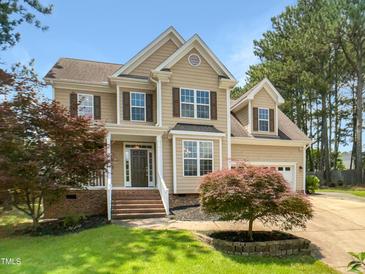 Charming two-story home with a manicured lawn and beautiful curb appeal at 1201 Dagmar Ln, Wake Forest, NC 27587