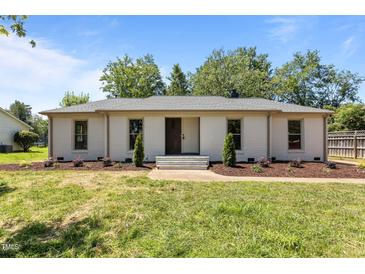 Charming single-story home with fresh paint, manicured landscaping, and inviting front entrance at 620 Red Carriage Ave, Durham, NC 27704