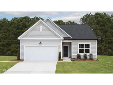 Charming single Gathering home with a two car garage and well maintained lawn at 11751 Salers Loop Loop, Middlesex, NC 27557