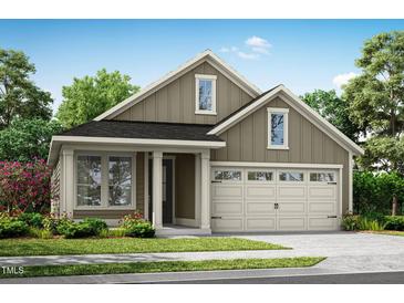 Charming single Gathering home with neutral colors, lovely curb appeal, two car garage and manicured front yard at 152 Serene Xing, Fuquay Varina, NC 27526