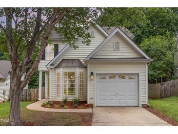 Charming home with a front yard, mature trees and an attached one car garage at 2409 Valley Haven Dr, Raleigh, NC 27603