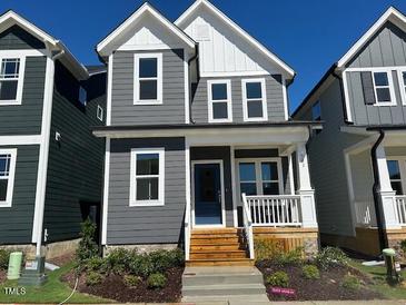 Charming two-story home with gray siding, white trim, and a welcoming front porch at 502 Yeowell Dr, Chapel Hill, NC 27514