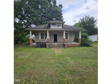 Charming single-Gathering home with a classic front porch and mature trees at 505 S 15Th St, Erwin, NC 28339