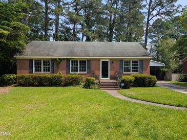 Charming brick home with well-manicured lawn and mature trees at 520 Charlotte Ave, Rocky Mount, NC 27804