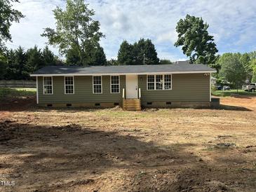 Charming single-story home with a freshly painted exterior, new roof, and unfinished front yard at 8505 Ray Rd, Raleigh, NC 27613