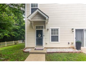 Charming two-story home with a welcoming front door and a landscaped yard at 320 Gilman Ln # 106, Raleigh, NC 27610