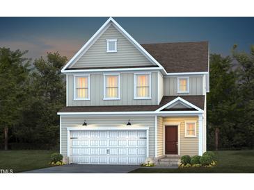 Charming two-story home with a two-car garage and professionally landscaped front yard at 432 Grange Farm Pl, Raleigh, NC 27603