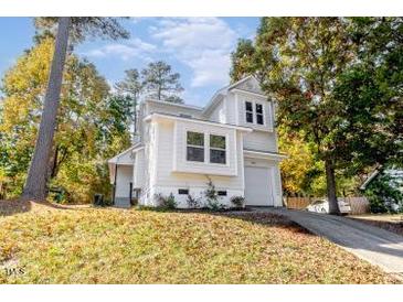 Charming two-story home with well-maintained landscaping and a private driveway at 460 Dickens Dr, Raleigh, NC 27610