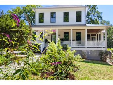 Charming two-story home with a beautiful front porch and landscaping at 508 N Wake St, Hillsborough, NC 27278
