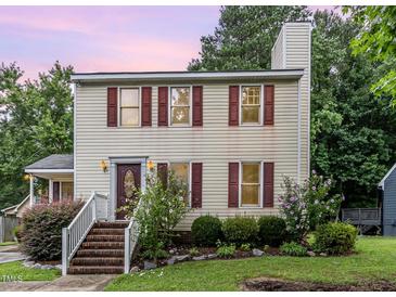 Charming two-story home with red shutters and brick steps leading to a welcoming front entrance at 3605 Iron Sight Ct, Raleigh, NC 27616