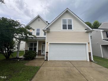 Charming two-story home with a two-car garage and well-maintained lawn at 3852 Cane Garden Dr, Raleigh, NC 27610
