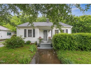 Charming single-story home with a cozy front porch, well-maintained lawn, and mature landscaping at 520 Park Ave, Rocky Mount, NC 27801