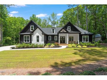 Charming two-story home featuring a manicured lawn and inviting curb appeal at 88 Priscilla Ln, Fuquay Varina, NC 27526