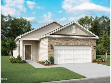 Charming single-Gathering home with a two-car garage, brick accents, and manicured front lawn at 1204 Solace Way, Rolesville, NC 27571