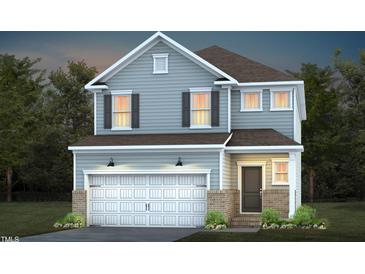 Charming two-story home with a two-car garage and classic architectural details at 416 Grange Farm Pl, Raleigh, NC 27603