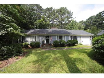 Charming home featuring a well-manicured lawn, tidy landscaping, and a welcoming facade at 6717 Valley Dr, Raleigh, NC 27612