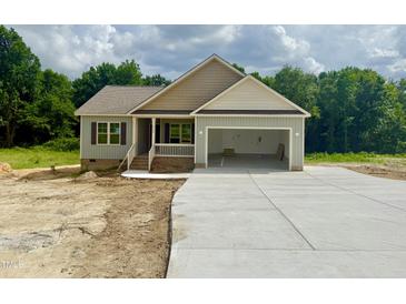 Charming single-story home with a two-car garage and covered porch, in a wooded area at 2760 Rains Mill Rd, Princeton, NC 27569