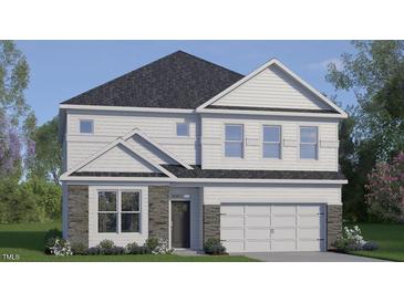 Charming two-story home with stone accents and a two-car garage at 413 Falls Bluff Dr, Wake Forest, NC 27587