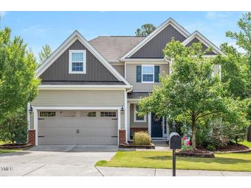 Charming two-story home featuring a two-car garage and well-maintained landscaping at 425 Cottonseed Way, Durham, NC 27703