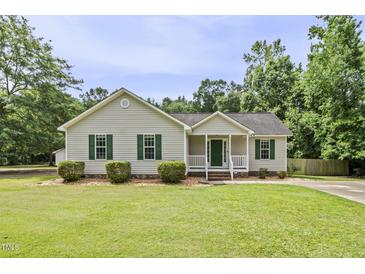 Charming one-story home with a well-manicured lawn and inviting front porch at 436 Madison Ave, Princeton, NC 27569