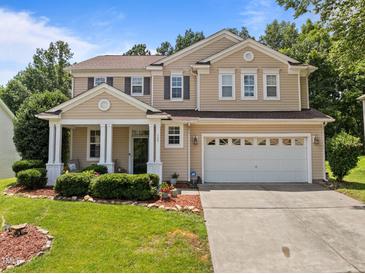Charming two-story home with manicured lawn and a two-car garage, perfect for families at 504 Ashburn Ln, Durham, NC 27703