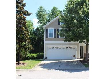 Charming two-story home featuring a two-car garage and well-maintained landscaping at 5126 Thornton Knoll Way, Raleigh, NC 27616