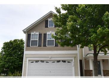 Charming two-story home features a white garage door and black shutters at 5126 Thornton Knoll Way, Raleigh, NC 27616
