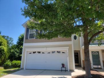 Two-story home featuring a two-car garage and a well-maintained lawn at 5126 Thornton Knoll Way, Raleigh, NC 27616