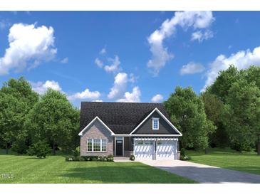 Charming single-story home with a brick facade, two-car garage, and a well-manicured front yard at 196 Glen Hollow Dr, Raleigh, NC 27604