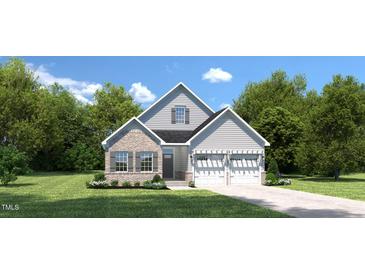 Charming two-story home with a mix of brick and siding, a two car garage, and well-manicured lawn at 198 Glen Hollow Dr, Raleigh, NC 27604