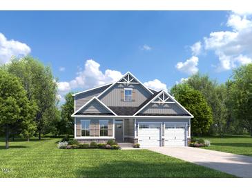Charming two-story home with a well-manicured lawn, complemented by a two-car garage and inviting front porch at 199 Glen Hollow Dr, Raleigh, NC 27604