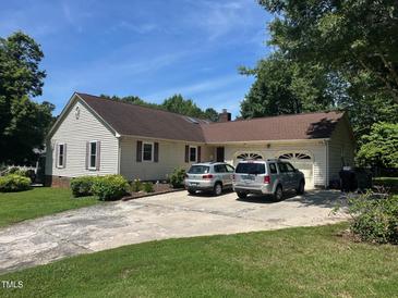 Charming single-story home features a two-car garage, neutral siding, and a well-maintained lawn at 2257 Delaney Dr, Burlington, NC 27215